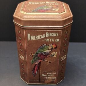 Vintage American Biscuit Tin,Brown With Parrot Design .
